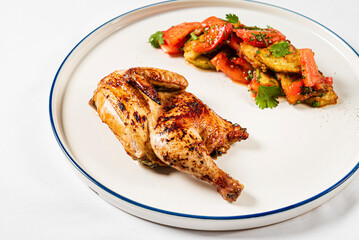 chicken with roasted vegetables on the white