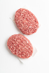  Raw minced homemade cutlets, on the white background