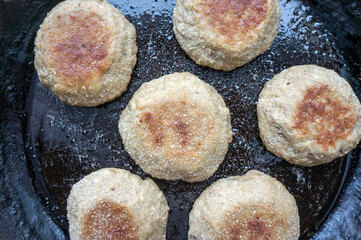 Fish cutlets in an old cast iron pan