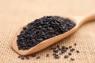 Black sesame close up shot on the sackcloth.