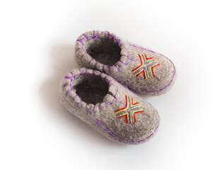 Children's felted gray Slippers with embroidered color pattern closeup on a white background