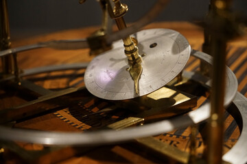 old copper astrolabe detail close up. The ancient astronomical Clock. replica of a medieval astrolabe which is a navigation instrument capable of 43 different astronomical calculations.