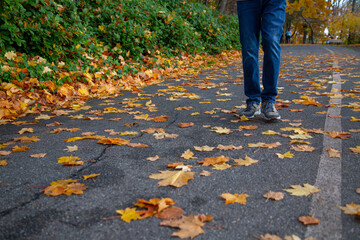 a man walking on the street in fall image 