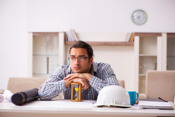 Young male architect working from house during pandemic