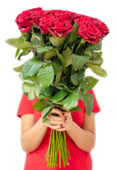 Girl with a bouquet of red roses isolated on a white