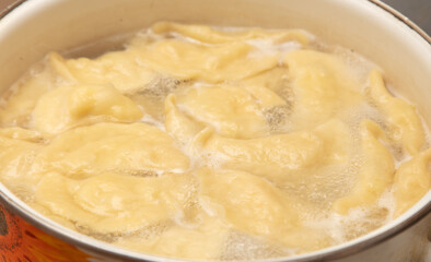 Dumplings cooked in a saucepan.