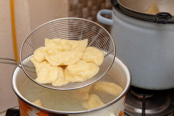 Dumplings cooked in a saucepan.