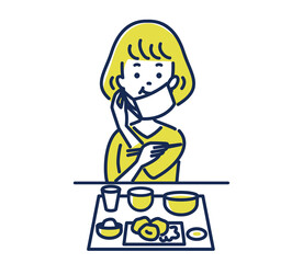 マスクをしながら食事する女性