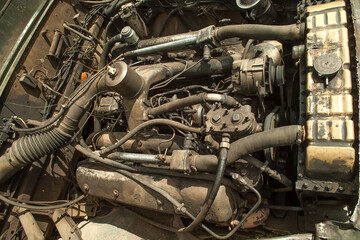 Old car engine. Radiator, pipes, metal.