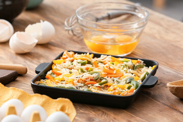 Cooking of rice casserole on table