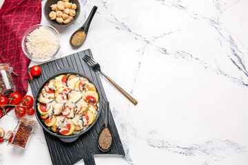 Baking dish with tasty rice casserole on table