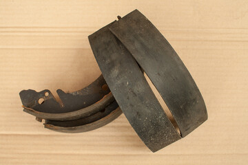 Old brake pads are folded up.