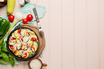 Baking dish with tasty rice casserole on table