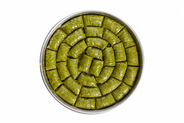 world famous baklava making in Gaziantep, baklava tray on white background. The Turkish name of this dessert variety is fıstıklı sarma