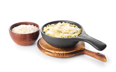 Baking dish with tasty rice casserole on white background