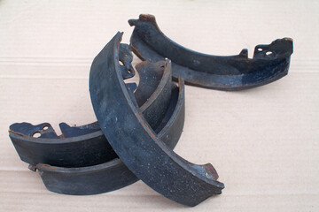 Old brake pads are folded up.