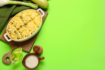 Baking dish with tasty rice casserole on color background