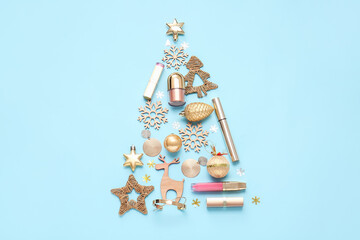 New Year composition with makeup cosmetics on color background