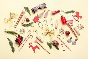 New Year composition with makeup cosmetics on color background