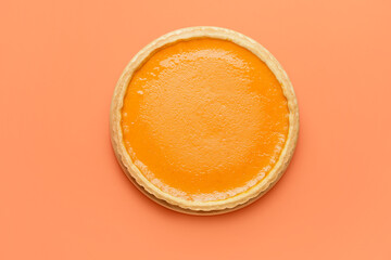 Tasty pumpkin pie on color background, top view