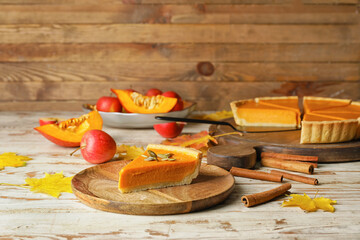 Composition with tasty cut pumpkin pie on table