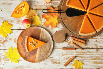 Composition with tasty cut pumpkin pie on table