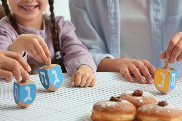 Happy family celebrating Hannukah at home, closeup