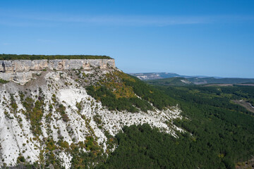 Fototapeta na wymiar Panoramic mountain view from the cave city of Chufut-Kale in the Republic of Crimea, Russia. A clear Sunny day on September 28, 2020