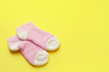 Warm socks on color background