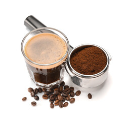 Glass of hot espresso and portafilter of coffee machine on white background