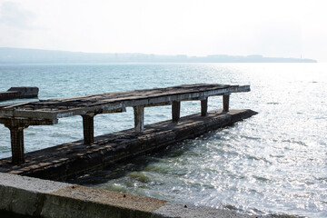 The pier on the sea with blue water