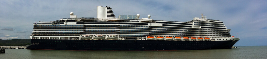 Full side of modern Holland America cruiseship or cruise ship liner in port