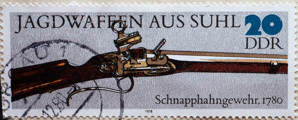 GERMANY, DDR - CIRCA 1978  : a postage stamp from Germany, GDR showing A historical hunting weapon...
