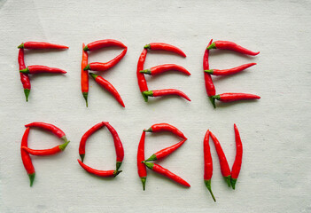 Words -free porn adult video written from red hot pepper letters isolated on white background