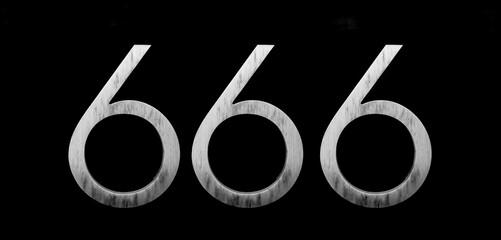 house number six hundred and sixty six (666) embossed in a metal plate. The number of the beast. Number of devil, satan on wooden door background