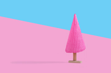 Creative concept with pink ice cream cone as Christmas tree. Christmas and holiday season concept