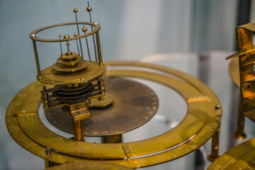 old, vintage model of the solar system Isolated on white background. brass astrolabe