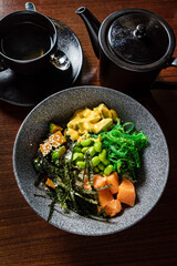 buddha bowl with fish and seaweed