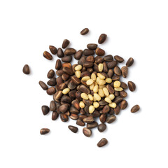 Unshelled pine nuts isolated on white