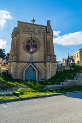 Fototapeta na wymiar Paola, Malta - December 6th 2018: Mausoleum at the Addolorata Cemetery. Opened in 1869 and is the largest burial ground in Malta. 