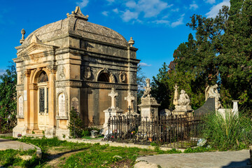 Fototapeta na wymiar Paola, Malta - December 6th 2018: Mausoleum at the Addolorata Cemetery. Opened in 1869 and is the largest burial ground in Malta. 