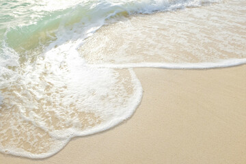 Sea wave on white sand beach