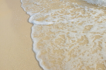 Sea wave on white sand beach