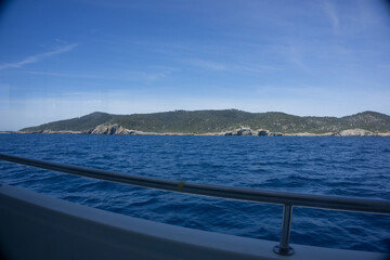 The sea with small ships on the shores of the Spanish island of Ibiza