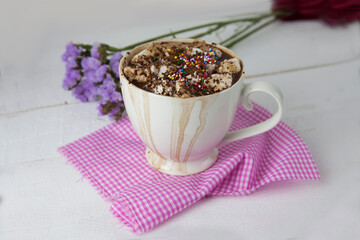 nice picture of a drink with smudges and marshmallows on a wooden surface