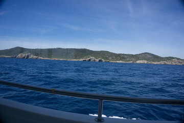The sea with small ships on the shores of the Spanish island of Ibiza