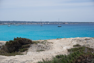 Fototapeta premium a bay with brilliant blue water from formentera a small island near ibiza 