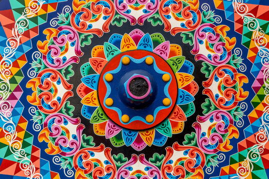 Geometric and colorful decorations of the wheels of traditional coffee transport carts in Costa Rica, Sarchi
