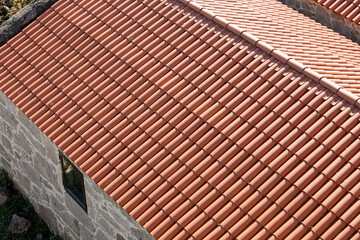 High angle view of a new roof made of traditional clay tiles. Old architecture