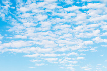 Abstract texture of white clouds on blue sky out of focus for use as background